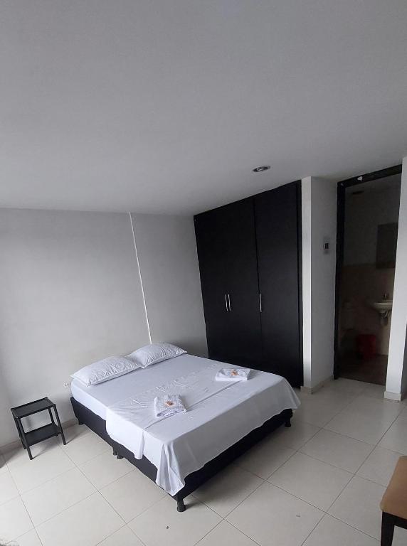 Postel nebo postele na pokoji v ubytování HOTEL MALU REAL POPAYAN Cauca