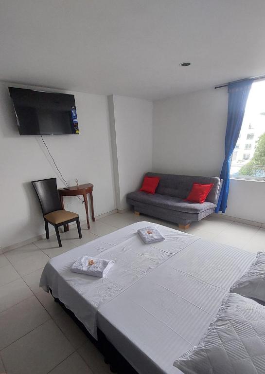 Postel nebo postele na pokoji v ubytování HOTEL MALU REAL POPAYAN Cauca
