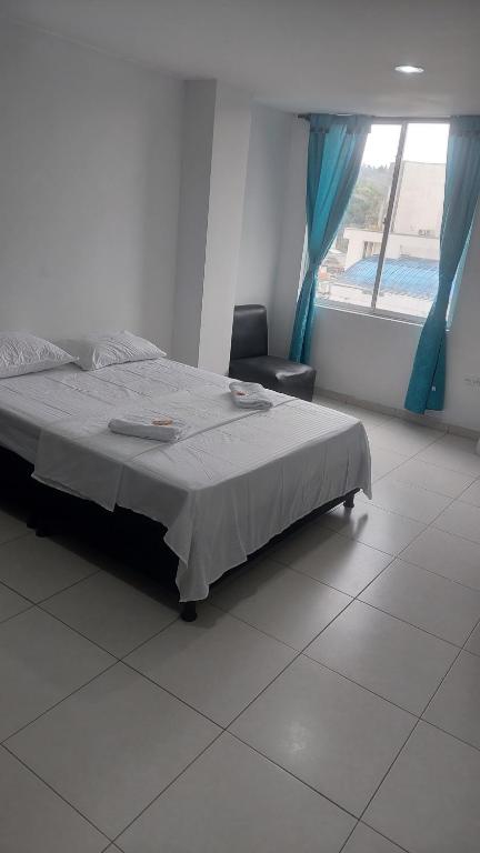 Postel nebo postele na pokoji v ubytování HOTEL MALU REAL POPAYAN Cauca