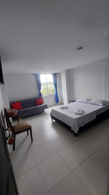 Postel nebo postele na pokoji v ubytování HOTEL MALU REAL POPAYAN Cauca