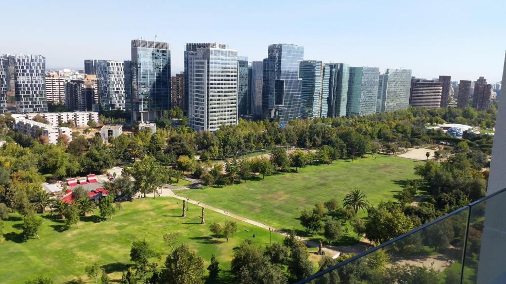 a park in the middle of a city with tall buildings at Apartment Cerro Colorado in Santiago