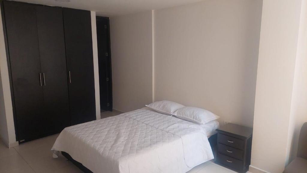 Postel nebo postele na pokoji v ubytování HOTEL MALU REAL POPAYAN Cauca