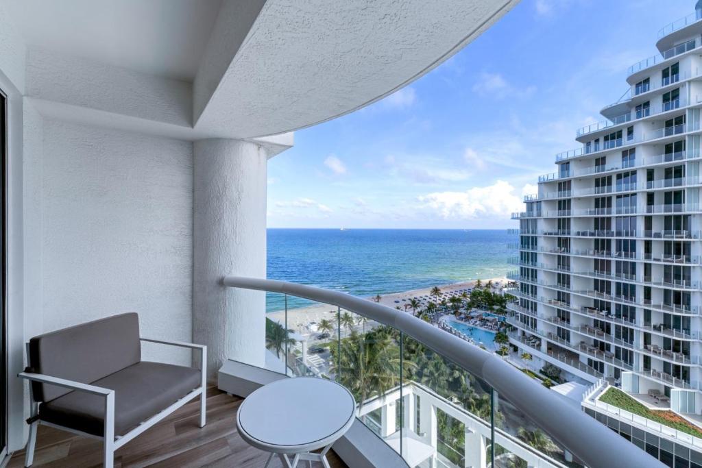 a balcony with a view of the ocean at Stylish Oceanview Apartment Prime Location in Fort Lauderdale