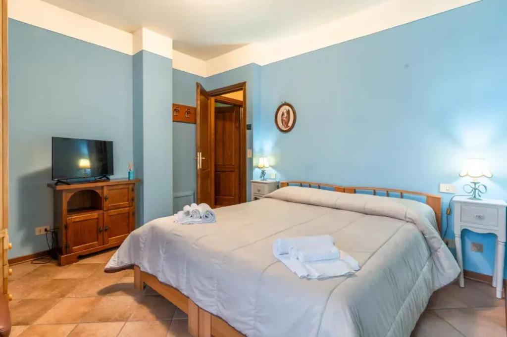 Posteľ alebo postele v izbe v ubytovaní Cozy House in Castelnuovo di Garfagnana + Large Garden