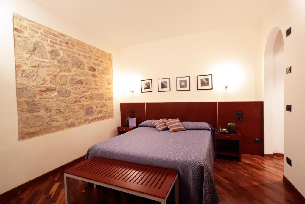 Postel nebo postele na pokoji v ubytování Relais La Corte di Bettona