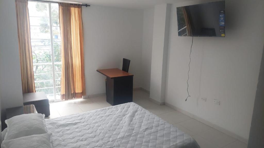 TV a/nebo společenská místnost v ubytování HOTEL MALU REAL POPAYAN Cauca
