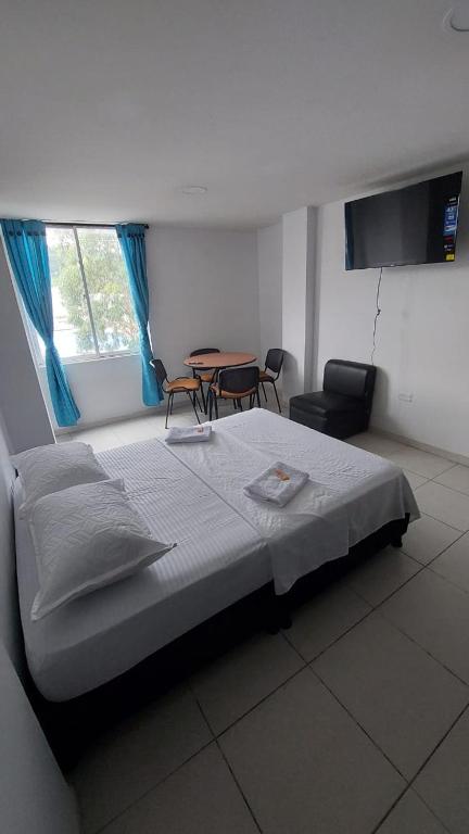 Postel nebo postele na pokoji v ubytování HOTEL MALU REAL POPAYAN Cauca