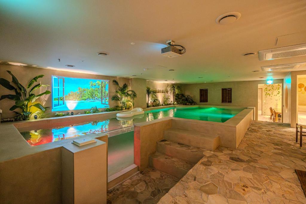 a pool in a house with a swimming pool at Maison de Onu Gwangju Cheomdan in Gwangju