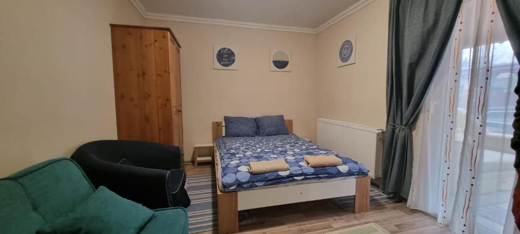 A bed or beds in a room at DalmApartman