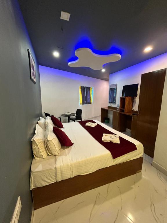 Ліжко або ліжка в номері The Elite Beachview