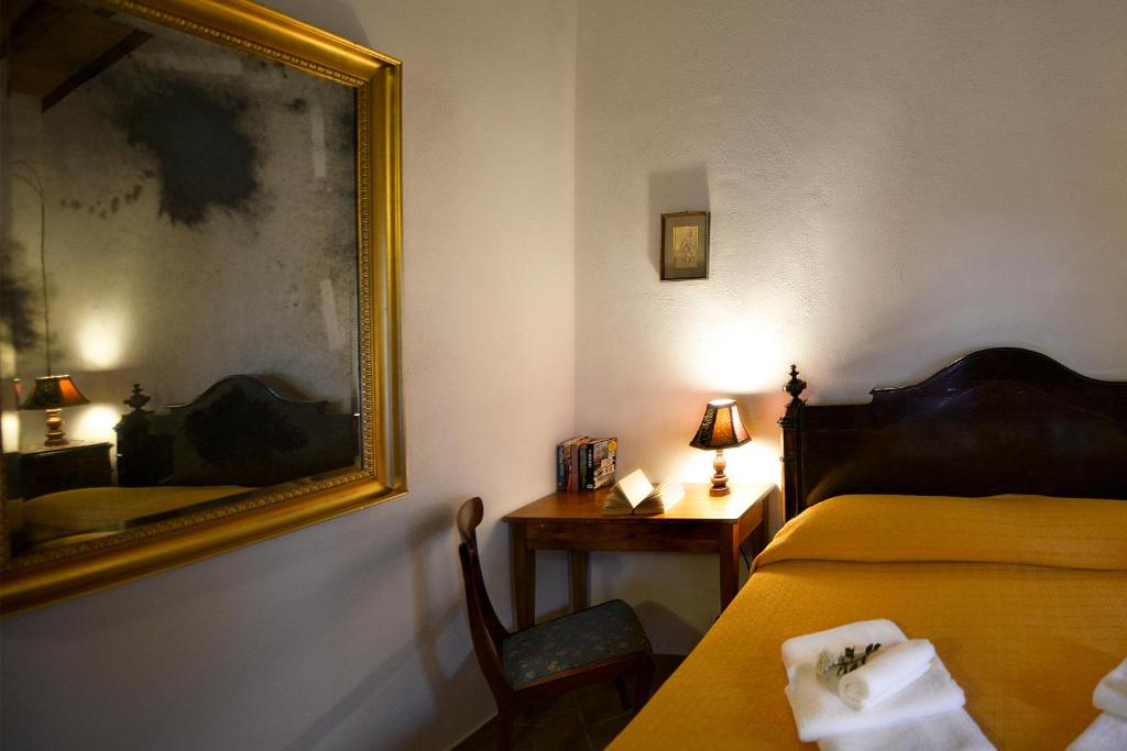 Postel nebo postele na pokoji v ubytování Podere Suvignano