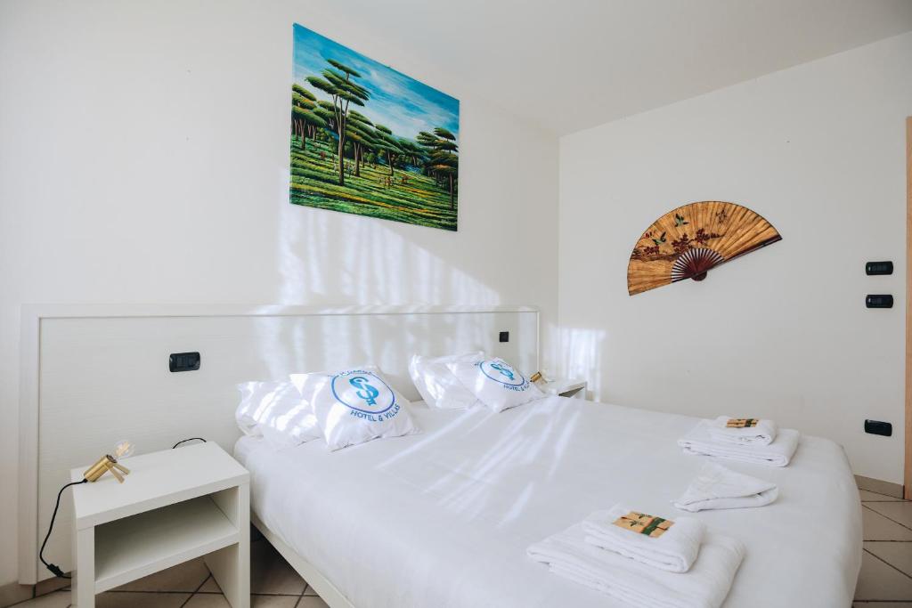 Łóżko lub łóżka w pokoju w obiekcie Residenza Pastrengo