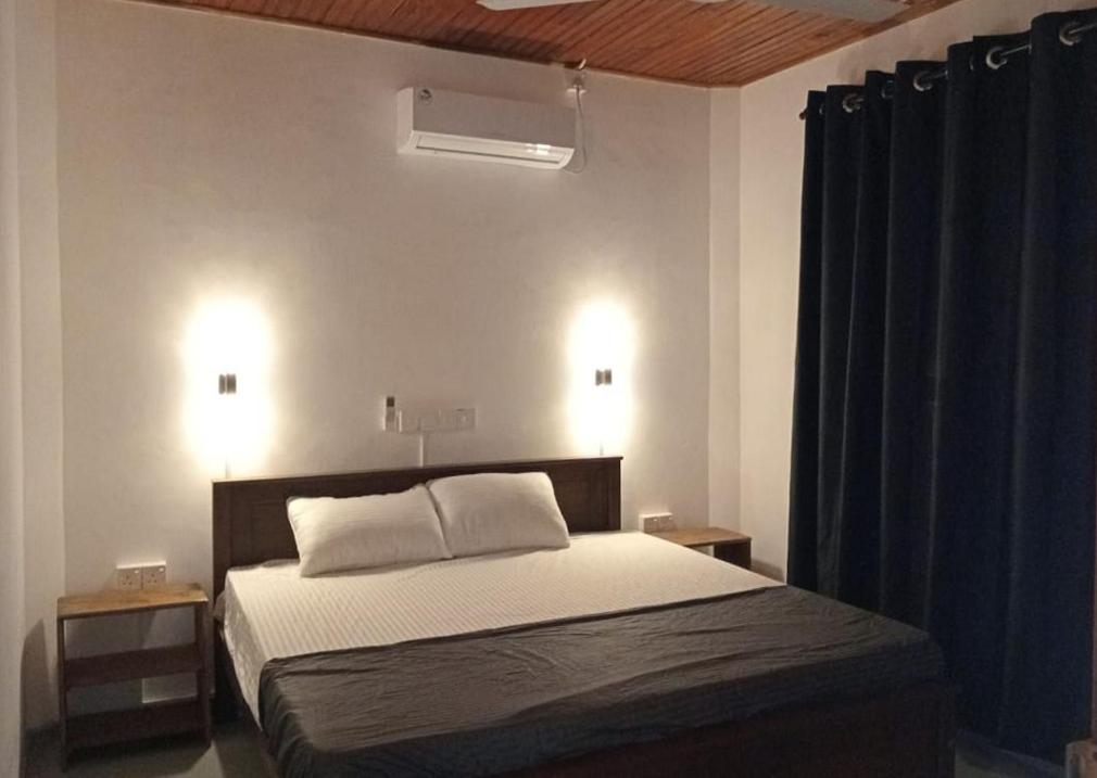 Postel nebo postele na pokoji v ubytování Aroma Ahangama