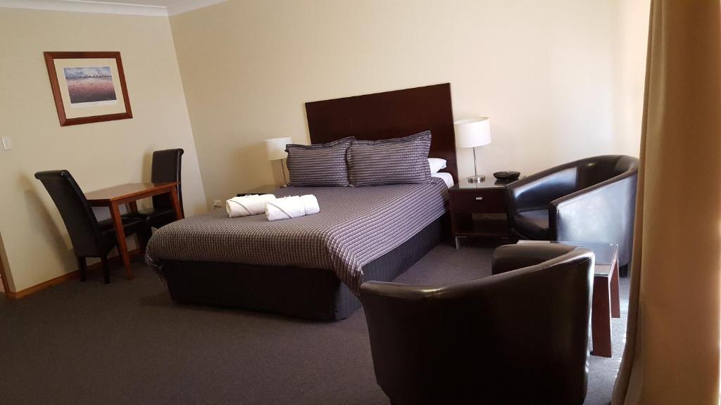 Postel nebo postele na pokoji v ubytování Gateway Motor Inn