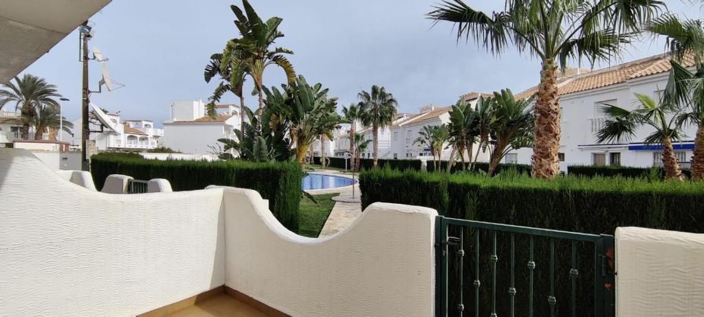 a view from the balcony of a house with palm trees at Apartamento LISA in Bolnuevo