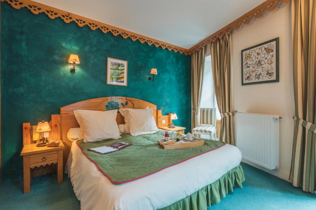 Postel nebo postele na pokoji v ubytování Hôtel Le Bois Joli