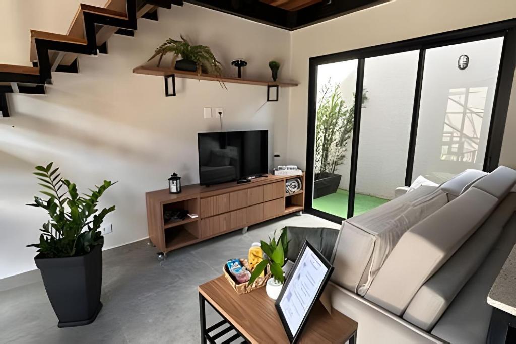 TV a/nebo společenská místnost v ubytování Amora Maria Residencial