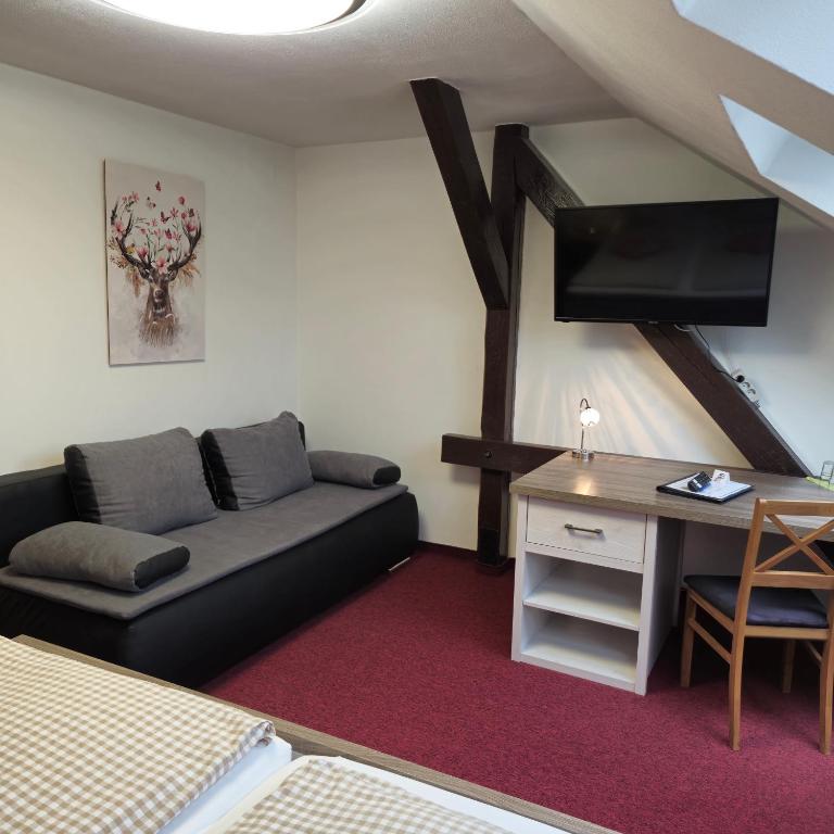 TV a/nebo společenská místnost v ubytování Hotel Meridian