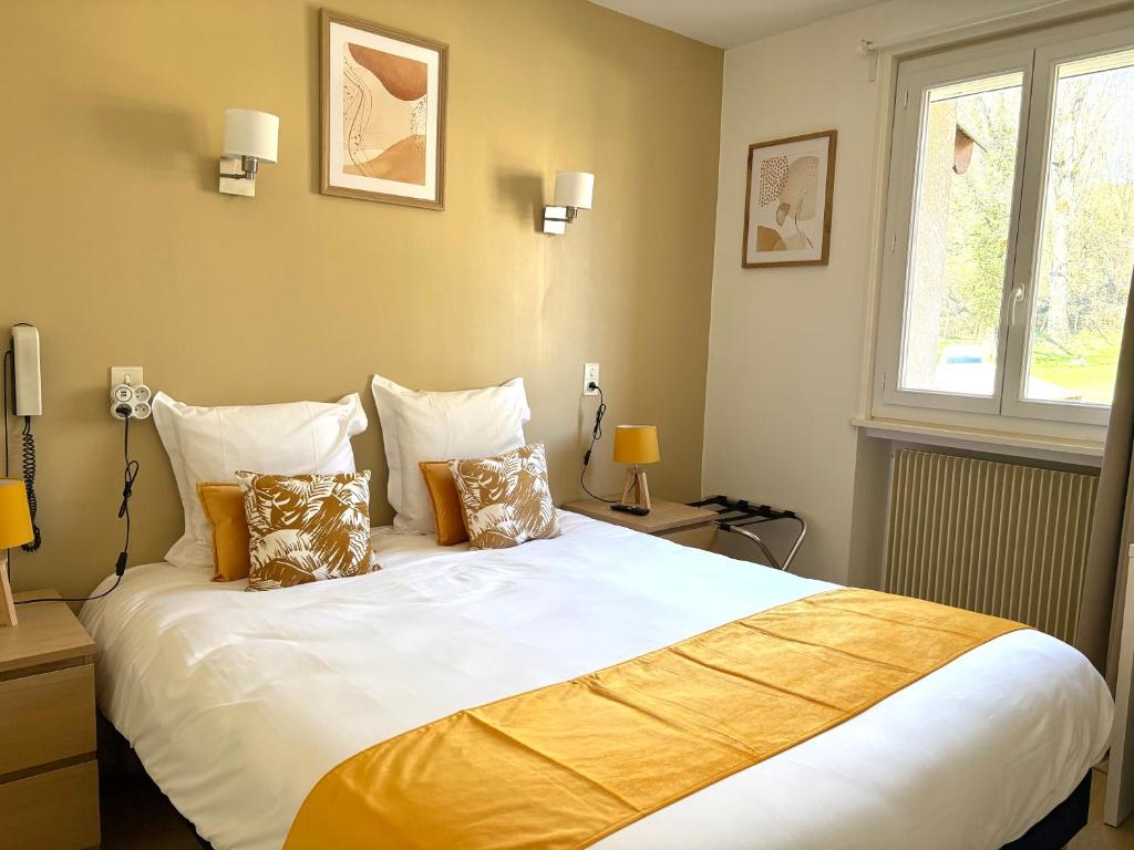 Postel nebo postele na pokoji v ubytování Hôtel Comme chez soi
