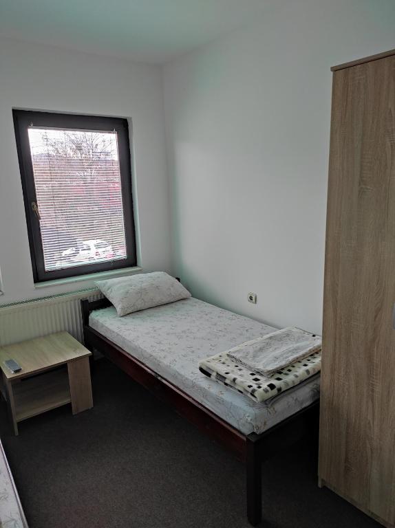 Postel nebo postele na pokoji v ubytování Mico NP Guest House