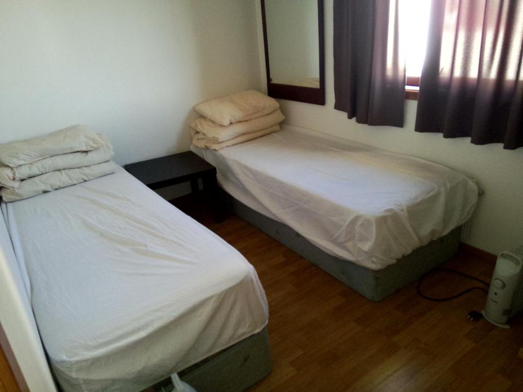 Postel nebo postele na pokoji v ubytování Gardenview Room