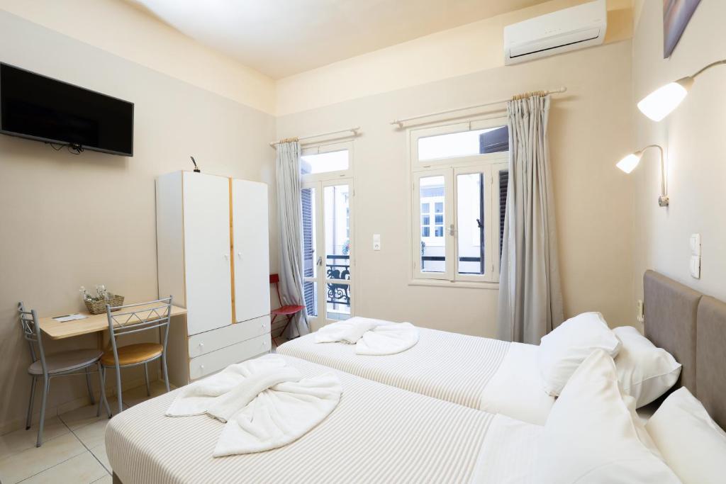 Postel nebo postele na pokoji v ubytování Balcony Studio