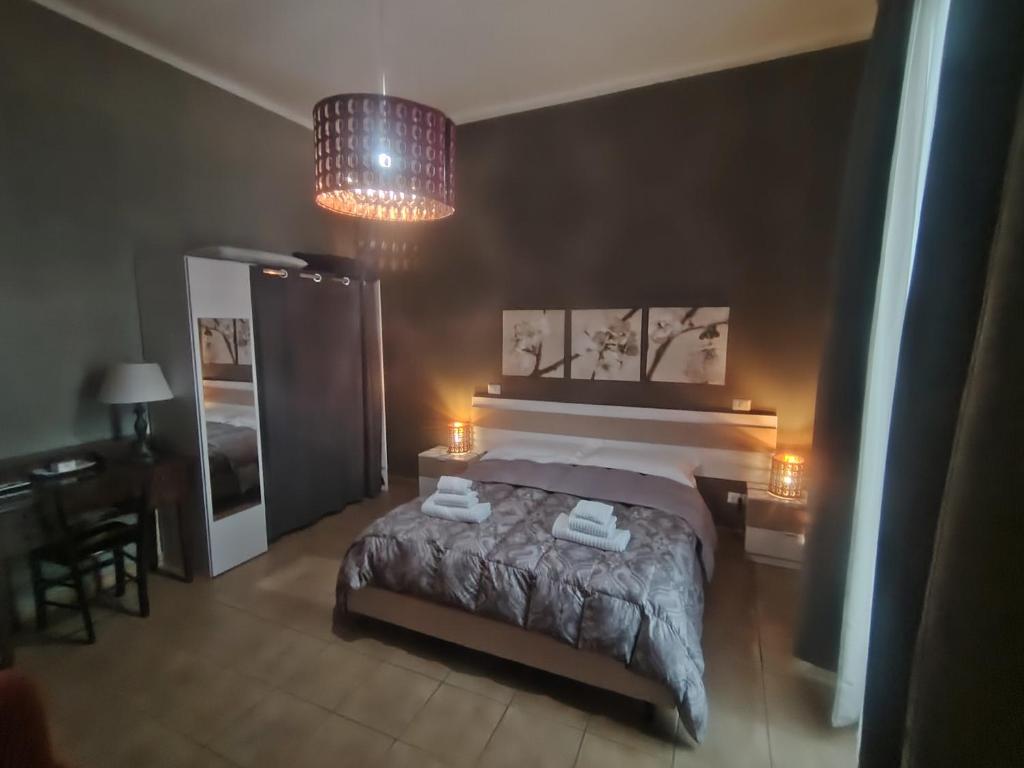 Łóżko lub łóżka w pokoju w obiekcie B&B Lucana 22