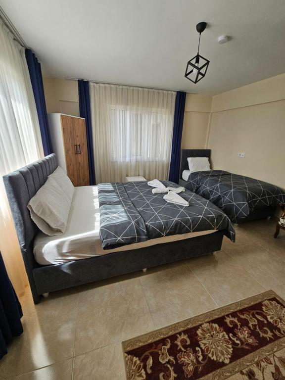 Postel nebo postele na pokoji v ubytování The Titanic House Hotel