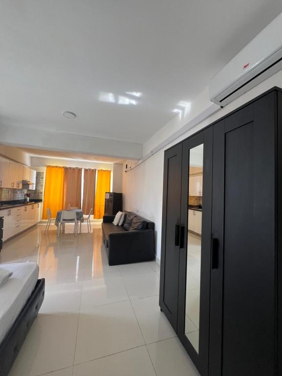 a living room with a couch and a table at punta cana bavaro apartamentos beach club los corales in Punta Cana
