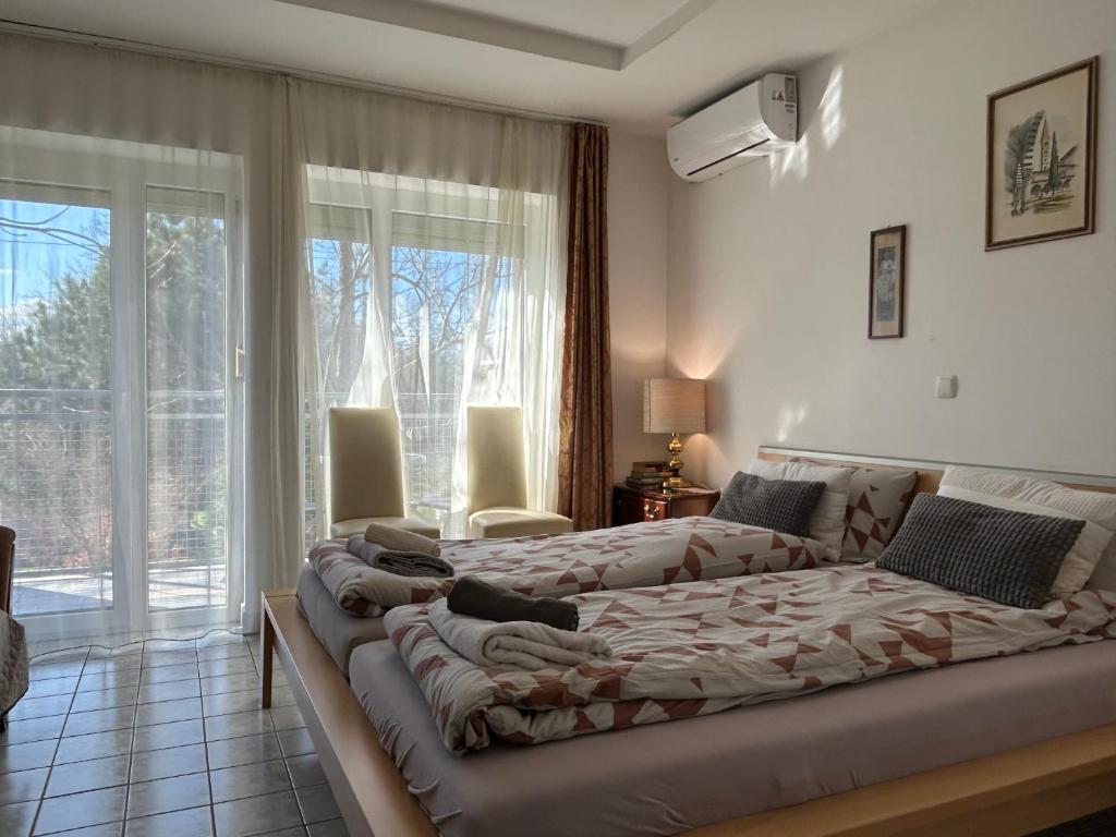Postel nebo postele na pokoji v ubytování Pansion Vila Vanda Vukovar