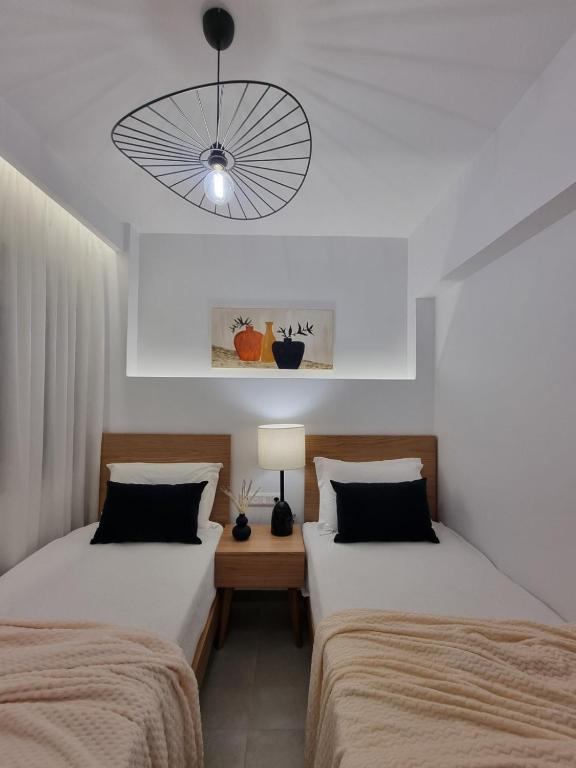 Hotel Andreas - Agistri (Skala) tesisinde bir odada yatak veya yataklar