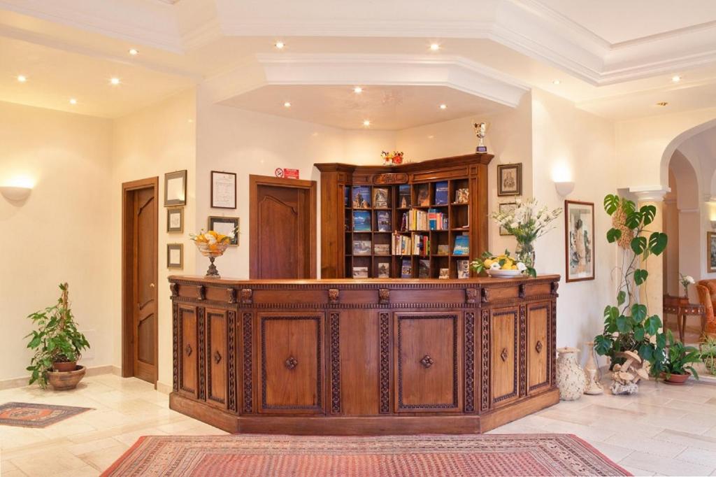 a large room with a large wooden counter in a building at Torre Bennistra in Scopello