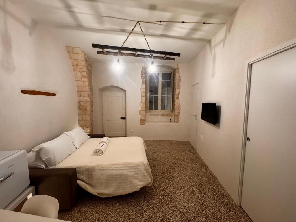 Postel nebo postele na pokoji v ubytování Borgo Sant Angelo