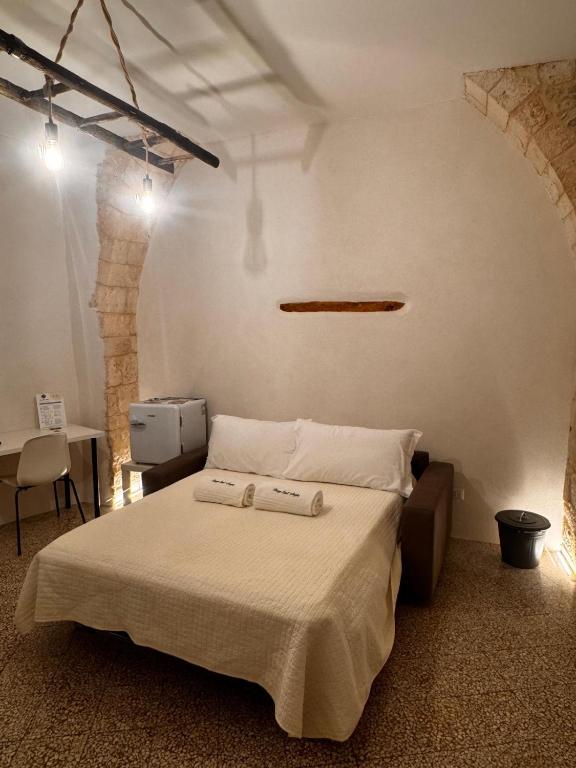 Postel nebo postele na pokoji v ubytování Borgo Sant Angelo