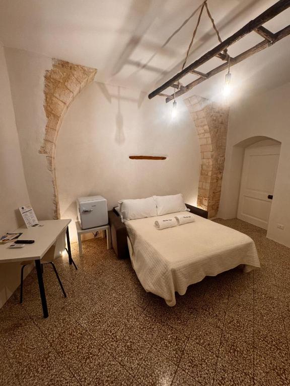 Postel nebo postele na pokoji v ubytování Borgo Sant Angelo
