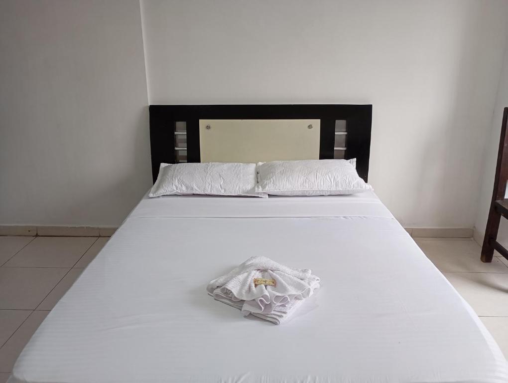 Postel nebo postele na pokoji v ubytování HOTEL MALU REAL POPAYAN Cauca