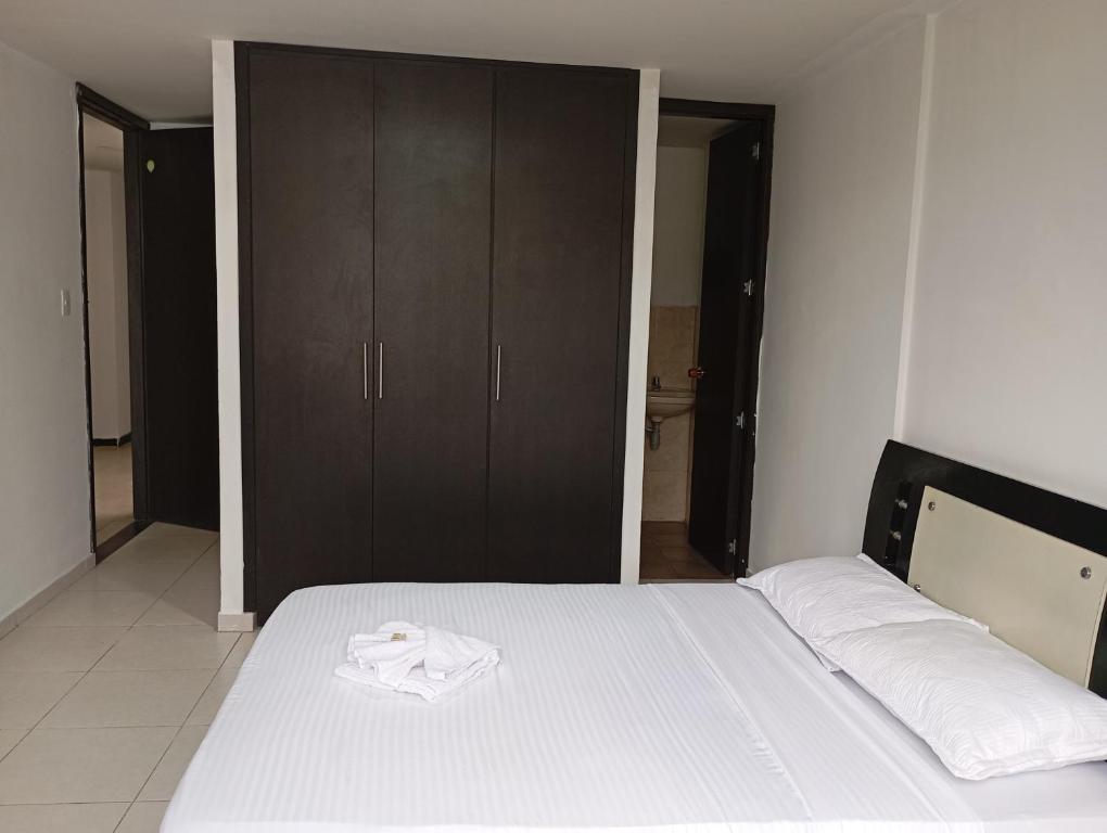 Postel nebo postele na pokoji v ubytování HOTEL MALU REAL POPAYAN Cauca