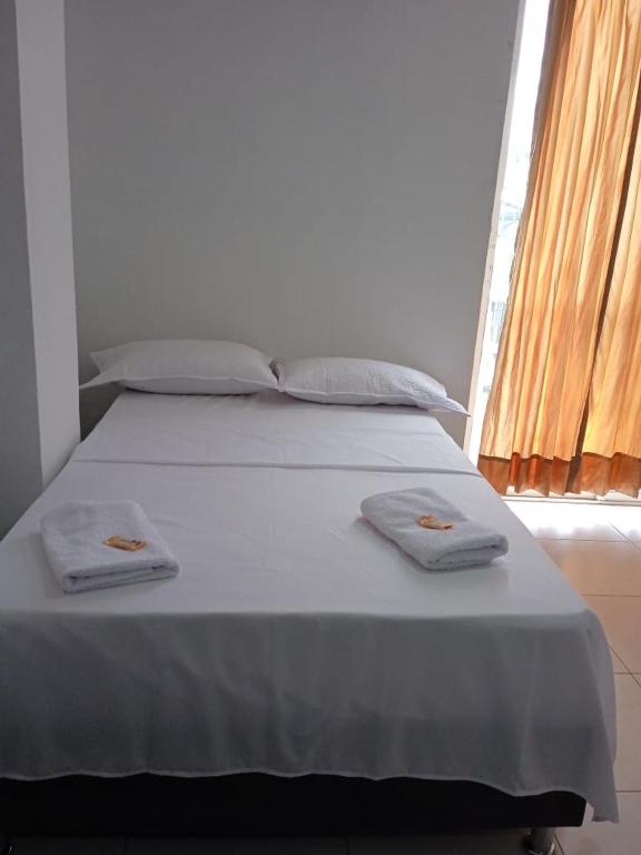 Postel nebo postele na pokoji v ubytování HOTEL MALU REAL POPAYAN Cauca