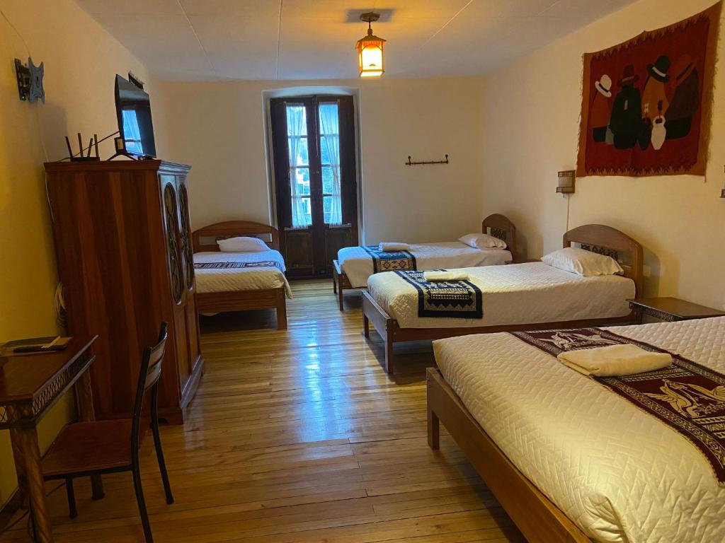 Postel nebo postele na pokoji v ubytování Mía Leticia B&B