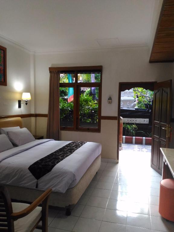 Postel nebo postele na pokoji v ubytování Hotel Sorga Cottages