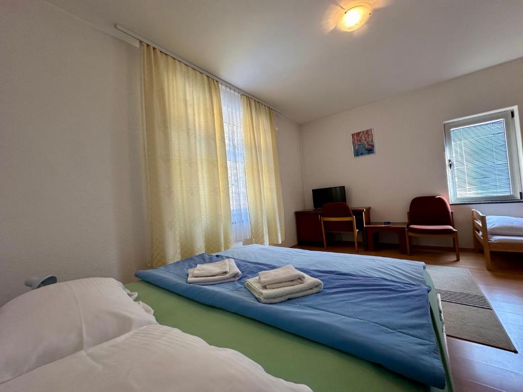 Postel nebo postele na pokoji v ubytování Wellness & Spa - Hotel Oaza