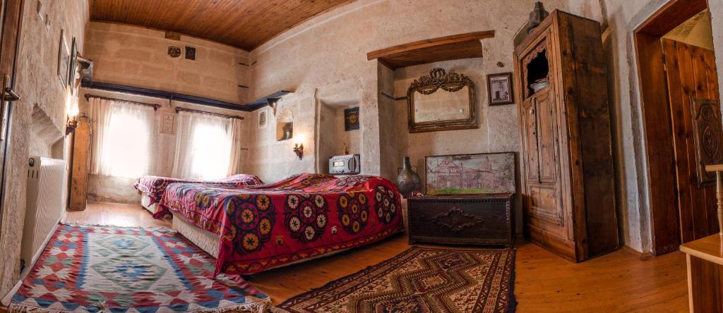 Postel nebo postele na pokoji v ubytování Kirkit Hotel