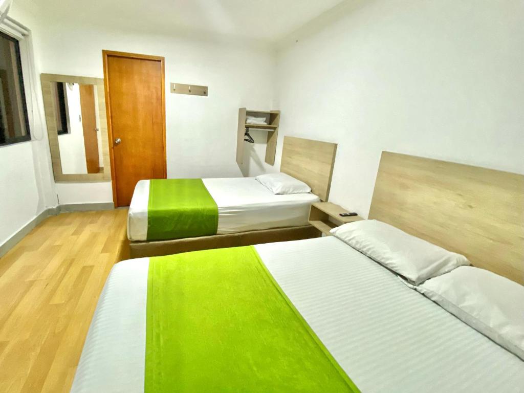 Postel nebo postele na pokoji v ubytování Hotel Boutique Street 50