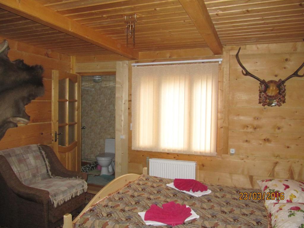 Postel nebo postele na pokoji v ubytování Sadiba Pid Skeleyu