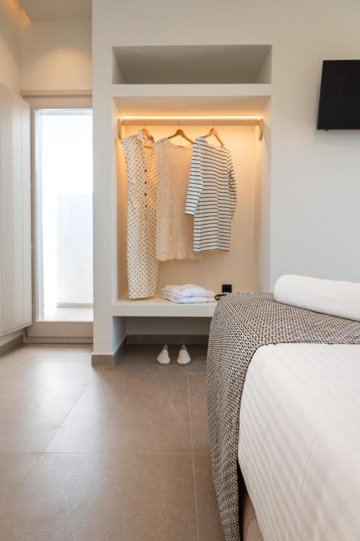 Postel nebo postele na pokoji v ubytování Depalyma Suites