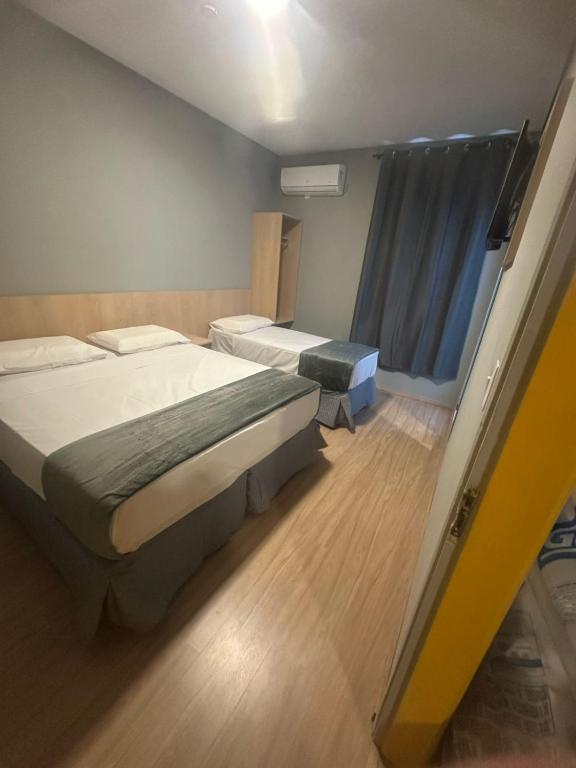 Postel nebo postele na pokoji v ubytování Unity Hotel - Campinas