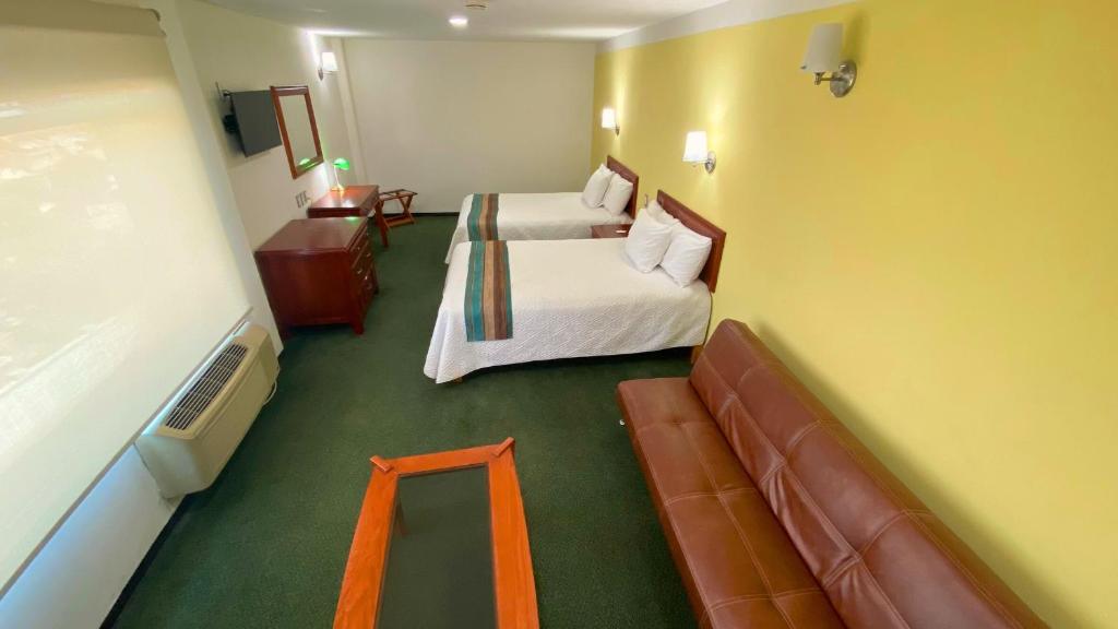 TV a/nebo společenská místnost v ubytování Hotel Enterprise Inn Poliforum