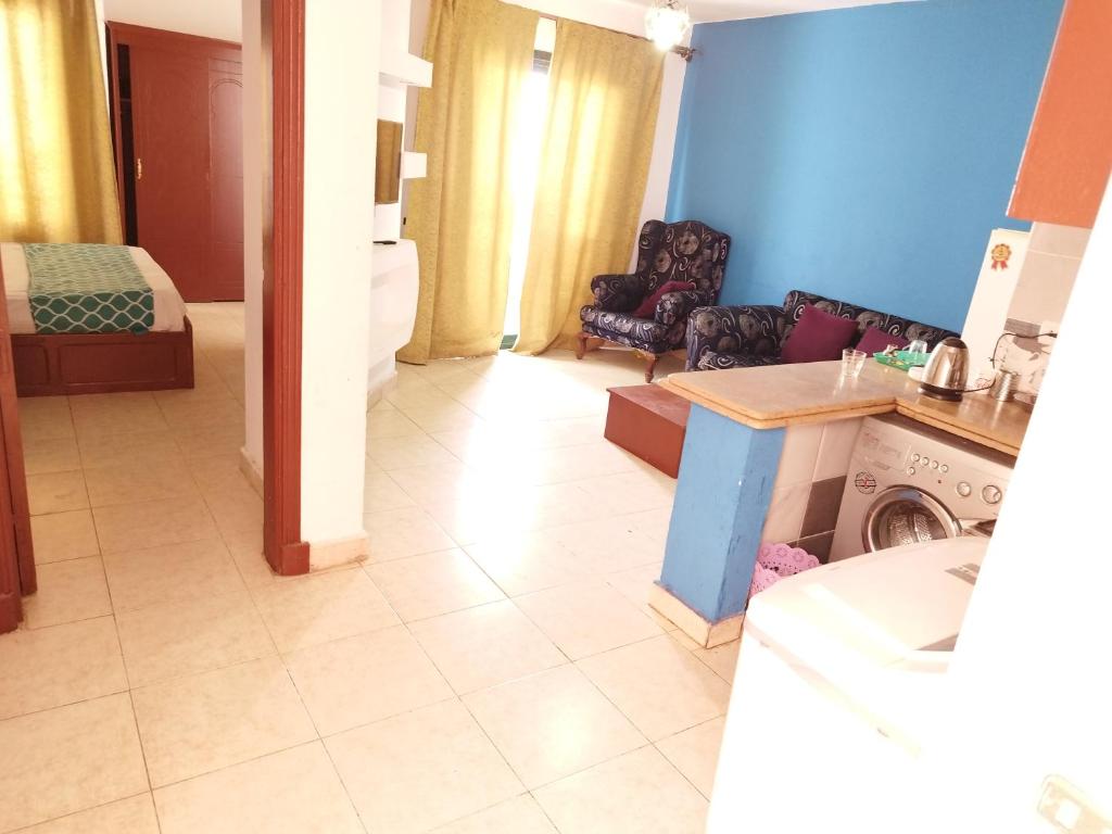 a living room with a couch and a table in a room at bella vita- city center- criss resort in Sharm El Sheikh