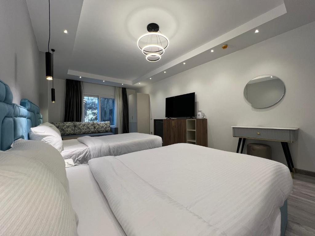 Postel nebo postele na pokoji v ubytování Onyx Pyramids Boutique Hotel
