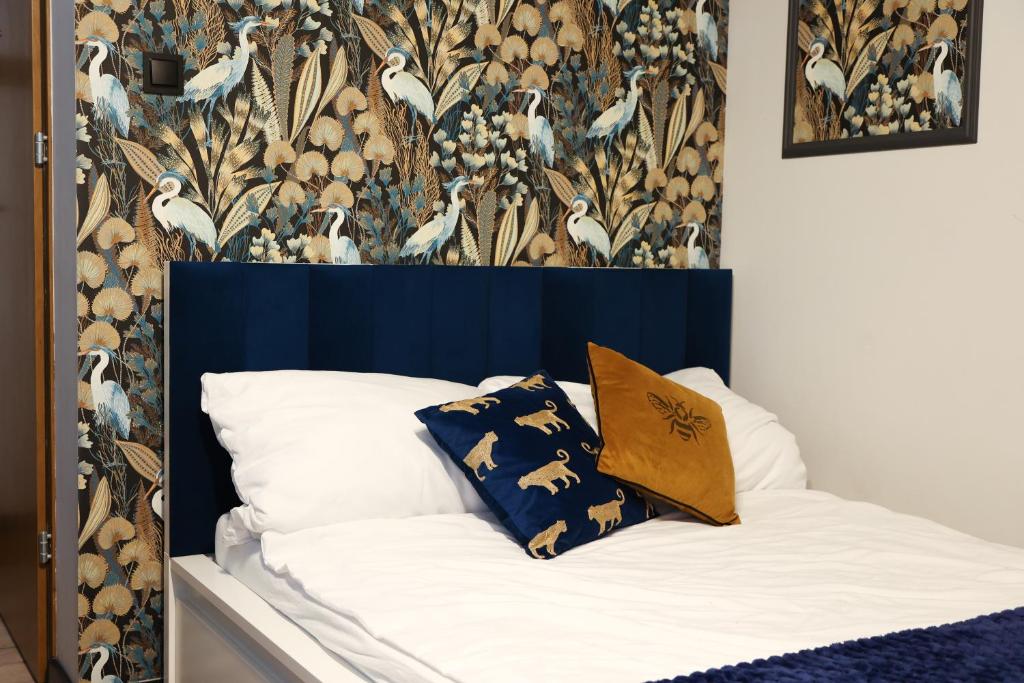 Postel nebo postele na pokoji v ubytování River House - Apartament z ogródkiem